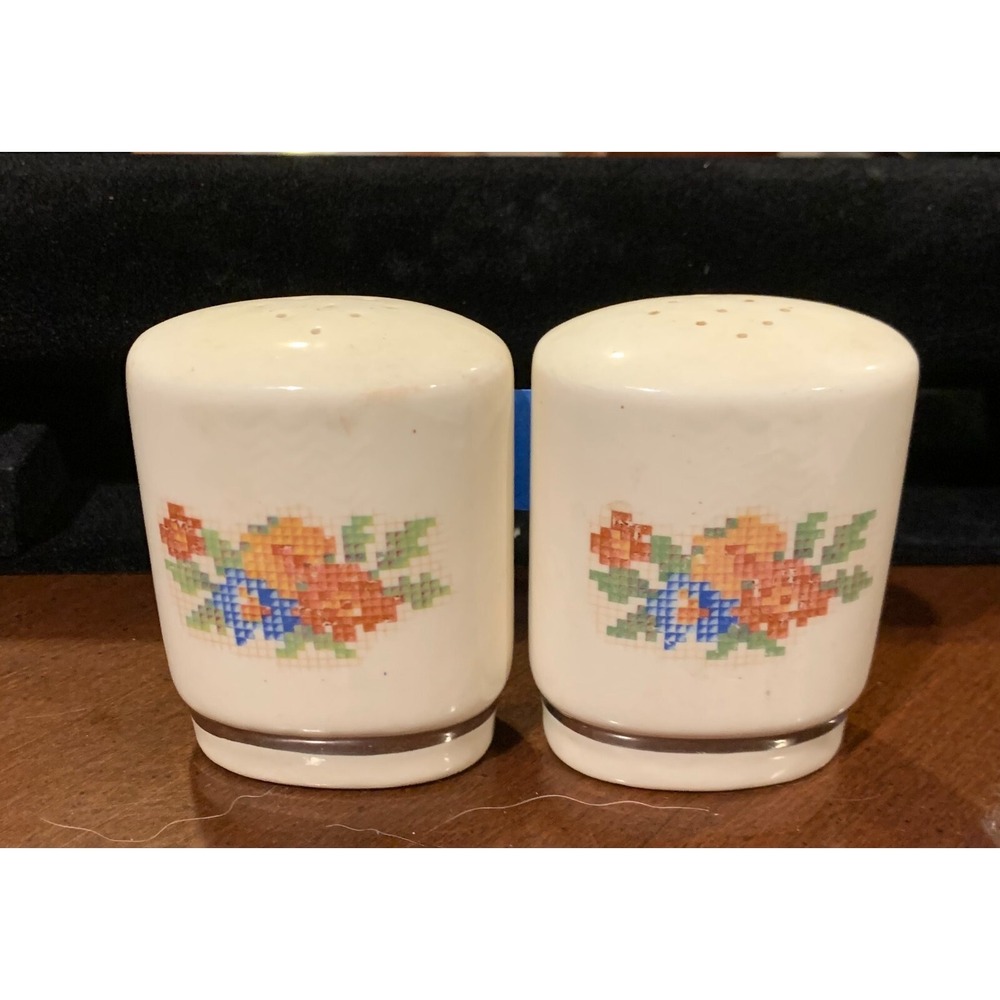 CERAMIC CREAM COLORED SALT AND PEPPER SHAKERS WITH GOLD TRIM AND EMBORDER DESIGN